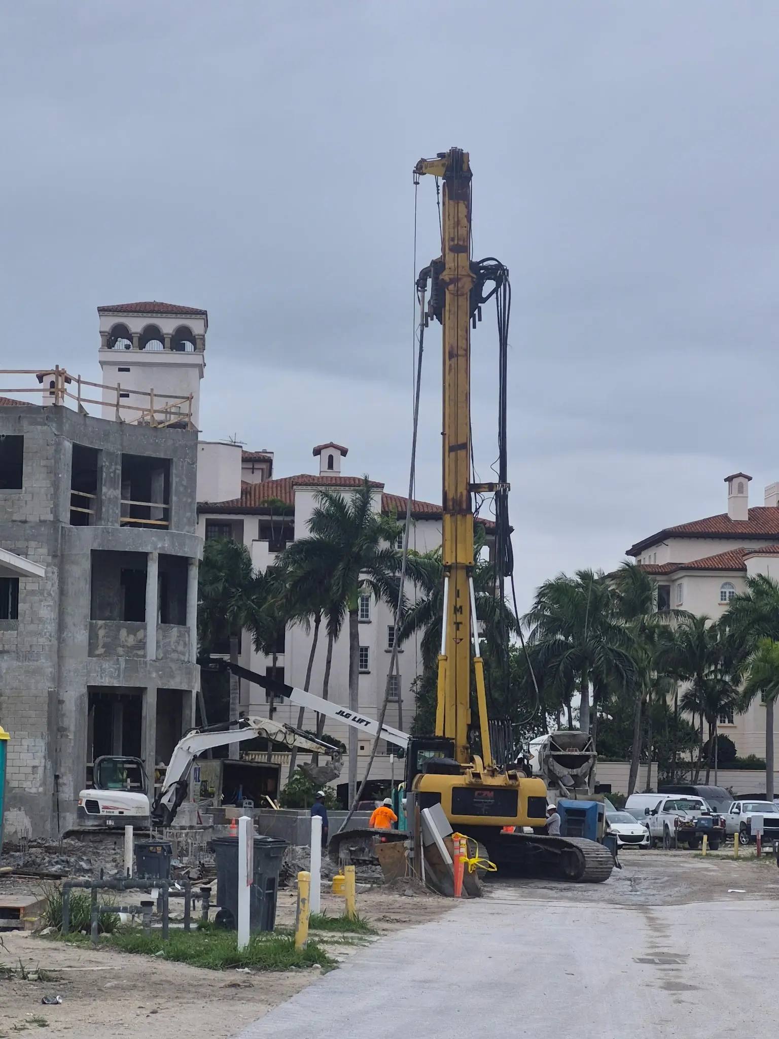 Foundation drilling rig operating on a Miami commercial job site