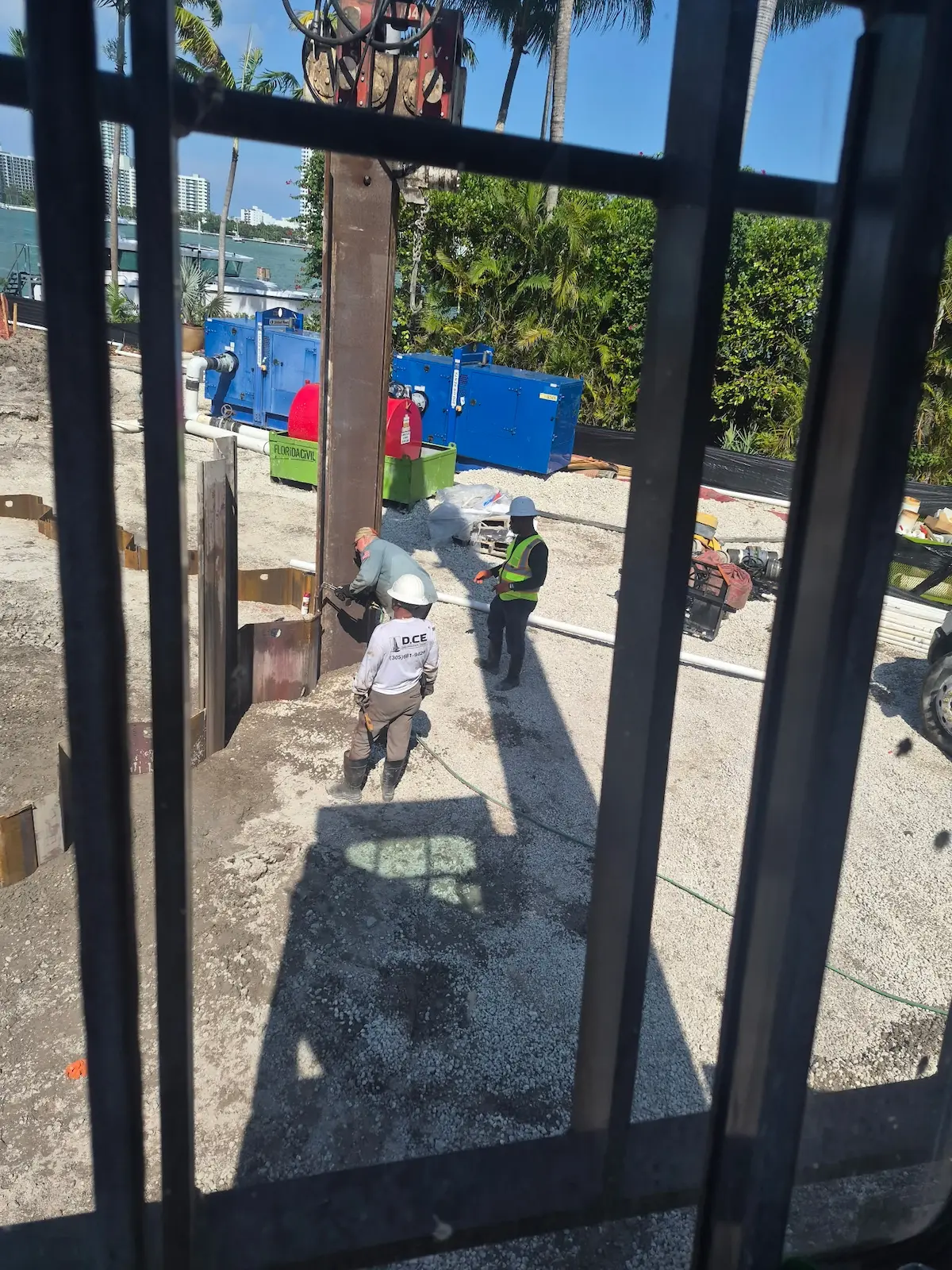 DCE field crew working with steel members near the waterfront