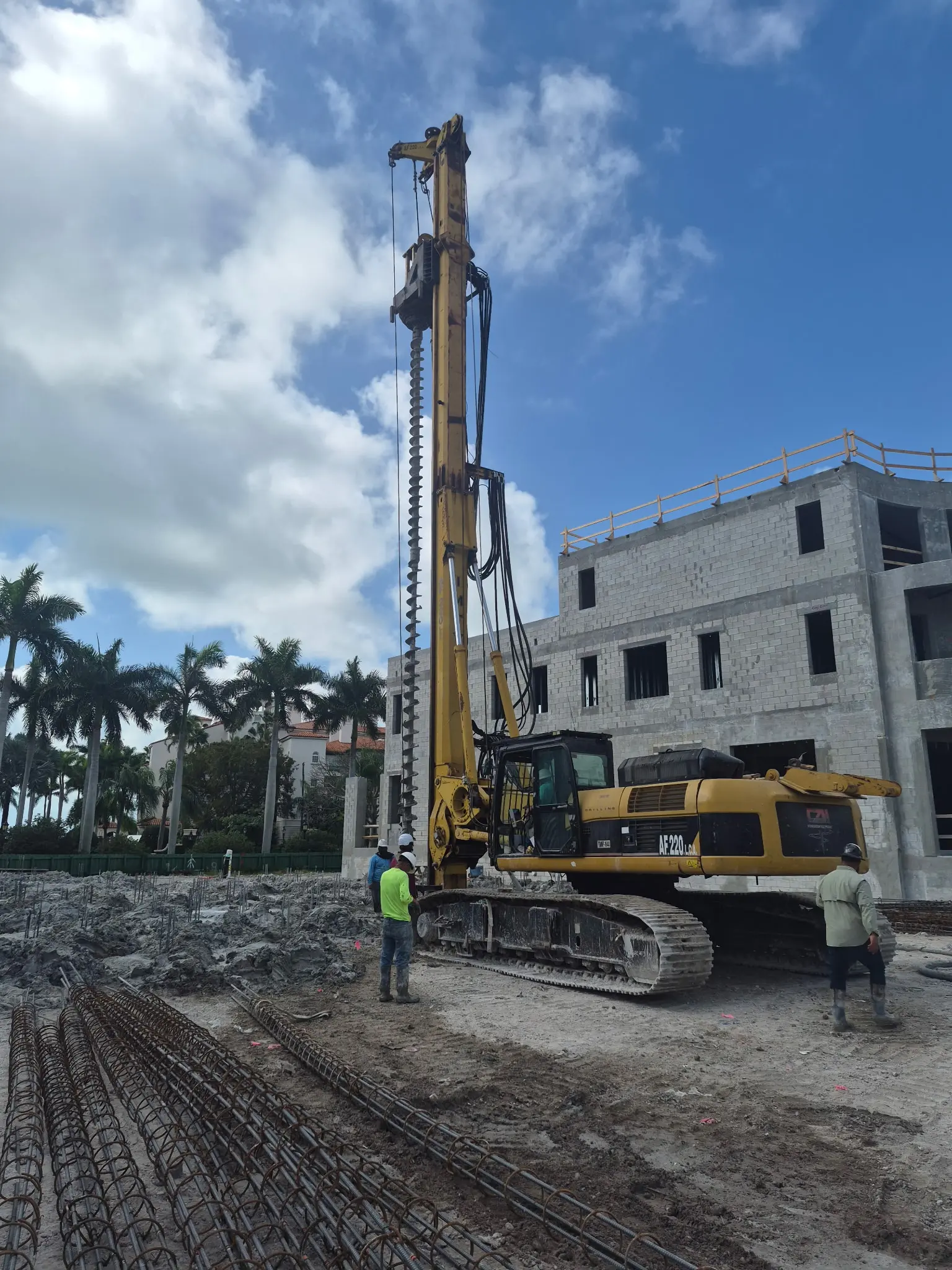 DCE Equipment Corp crew operating a foundation drilling rig on a Miami job site