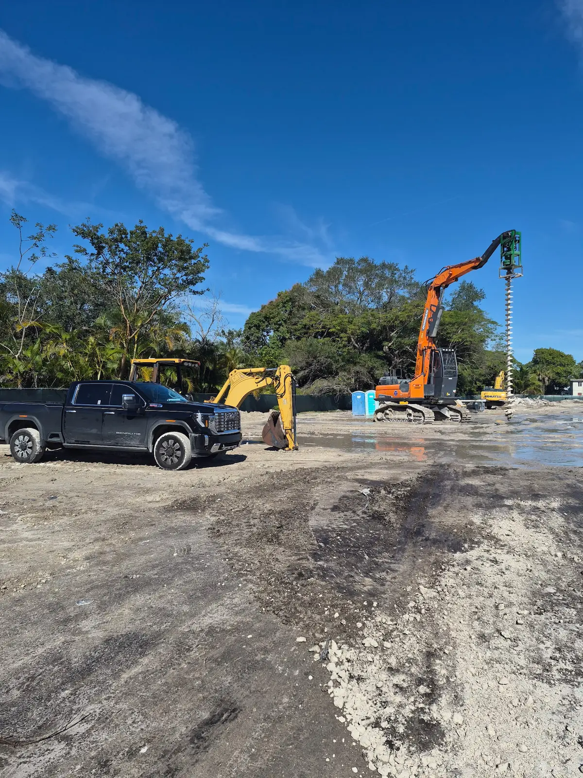 Equipment staged across an active construction site
