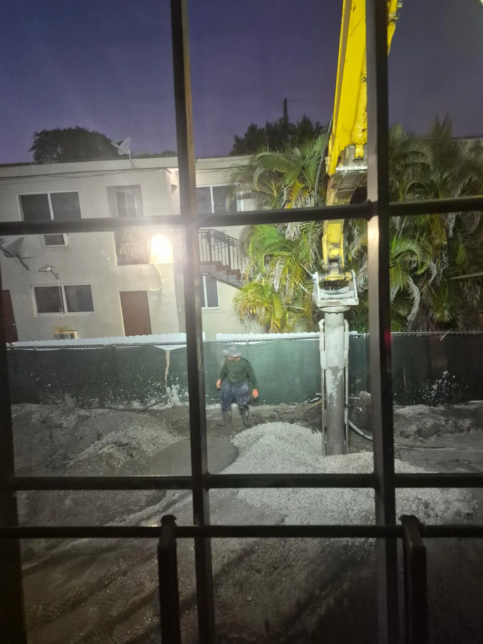 Foundation work beside a residential structure
